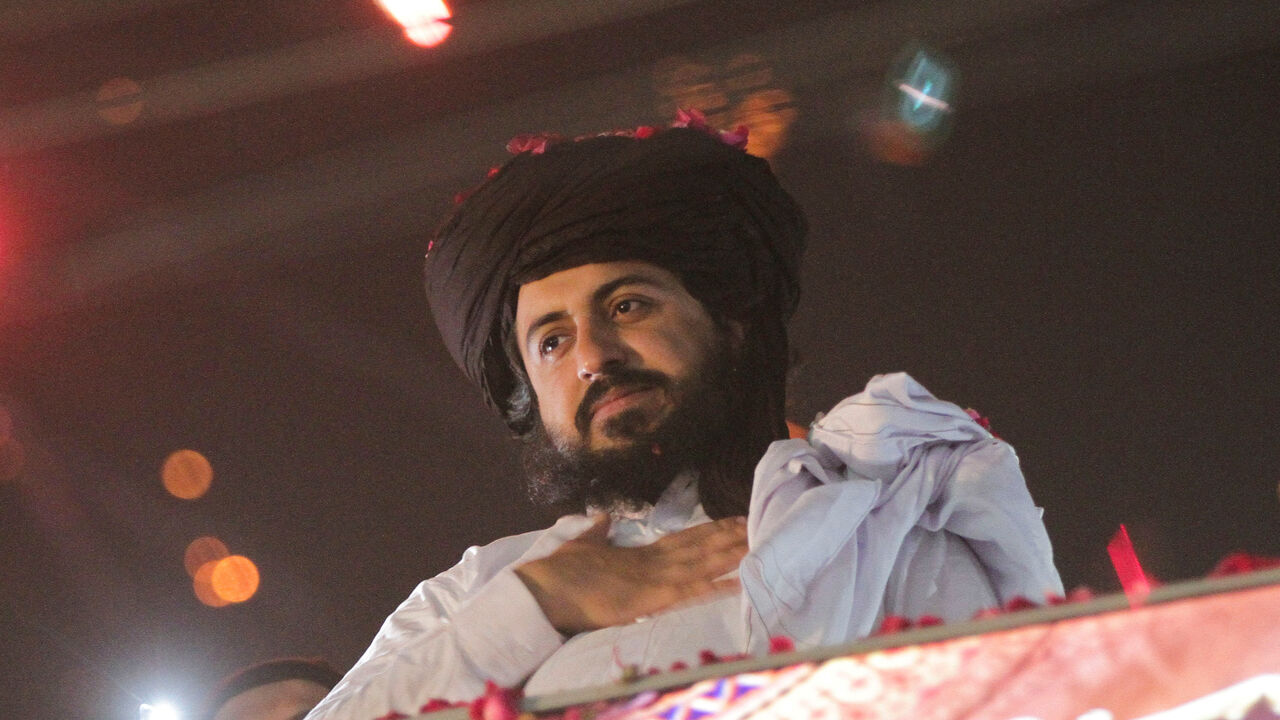 FILE PHOTO: Saad Hussain Rizvi, chief of Islamist political party Tehrik-e-Labaik Pakistan (TLP), gestures to his supporters after being released from jail in Lahore, Pakistan, November 18, 2021. REUTERS/Mohsin Raza/File Photo