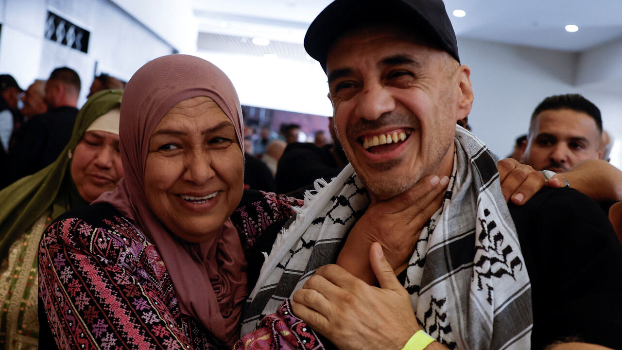 A freed Palestinian prisoner is greeted after being released from an Israeli jail as part of a hostages-prisoners swap and a ceasefire deal in Gaza between Hamas and Israel, in Ramallah, in the Israeli-occupied West Bank, October 13, 2025. REUTERS/Mohammed Torokman