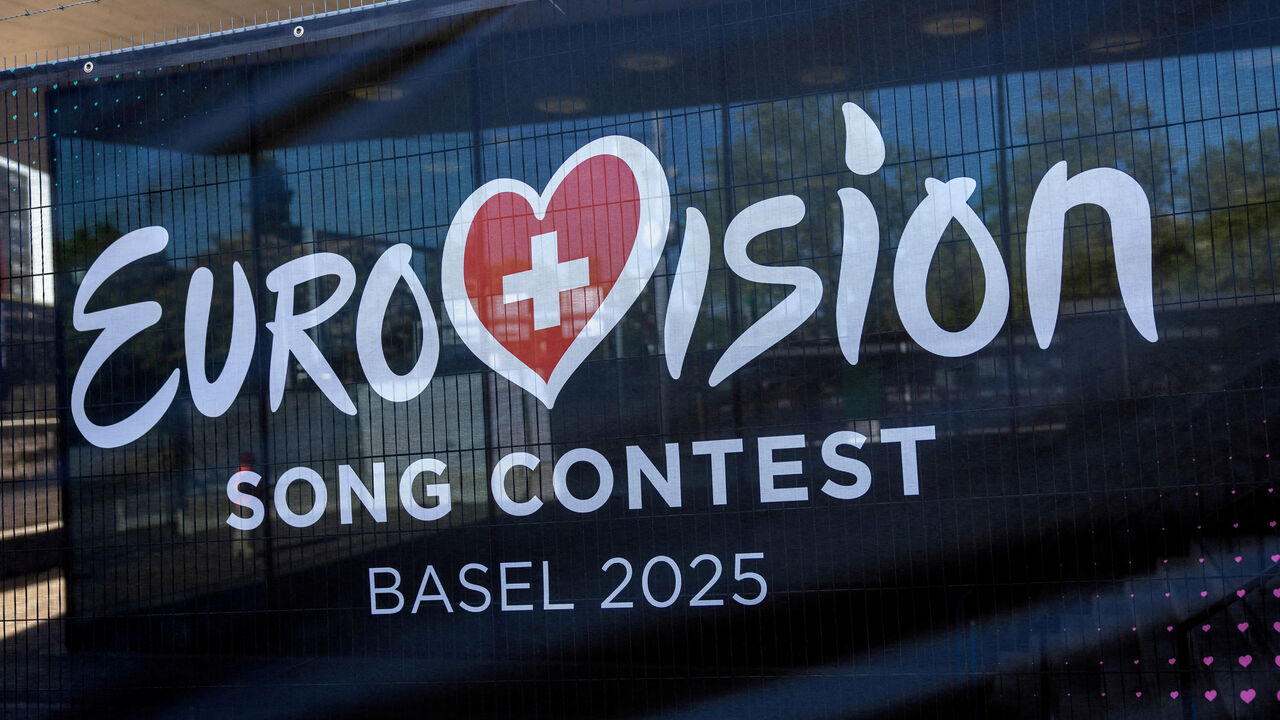 FILE PHOTO: A logo of the Eurovision Song Contest is seen in front of the St. Jakobshalle in Basel, Switzerland, May 1, 2025. REUTERS/Denis Balibouse//File Photo