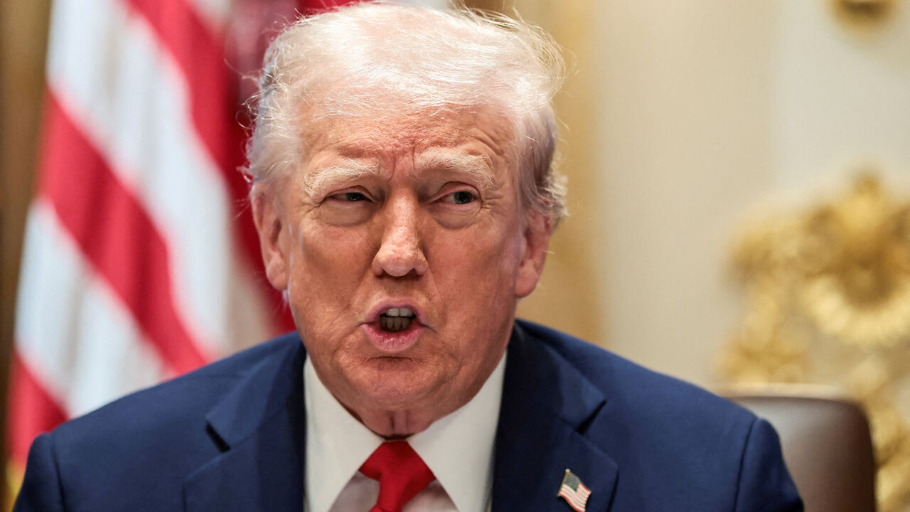 FILE PHOTO: U.S. President Donald Trump speaks during a cabinet meeting at the White House in Washington, D.C., U.S., October 9, 2025. REUTERS/Evelyn Hockstein/File Photo