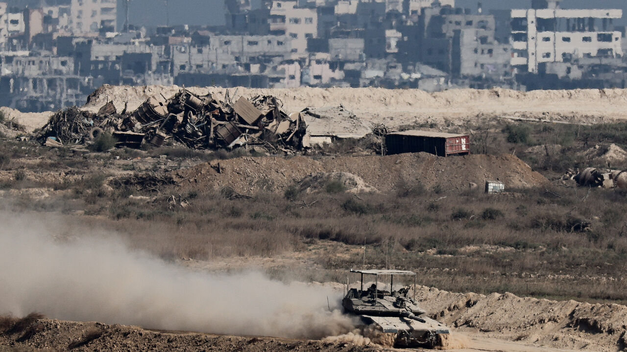 An Israeli tank manoeuvres in Gaza, as seen from the Israeli side of the border, September 28, 2025. REUTERS/Amir Cohen