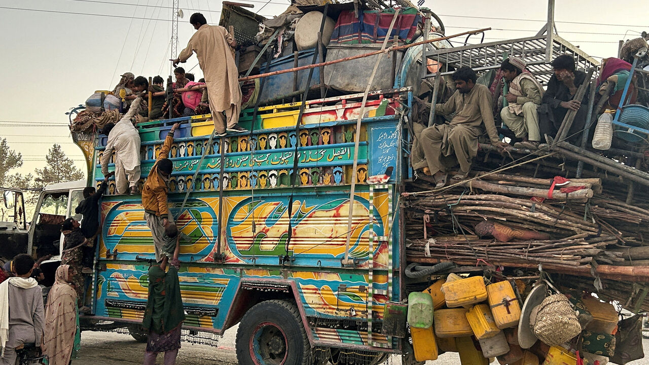Residents ride a loaded truck of belongings, as they flee the area, following exchanges of fire between Pakistan and Afghanistan forces, at the border crossing in Chaman, Balochistan province, Pakistan, October 15, 2025. REUTERS/Abdul Khaliq Achakzai