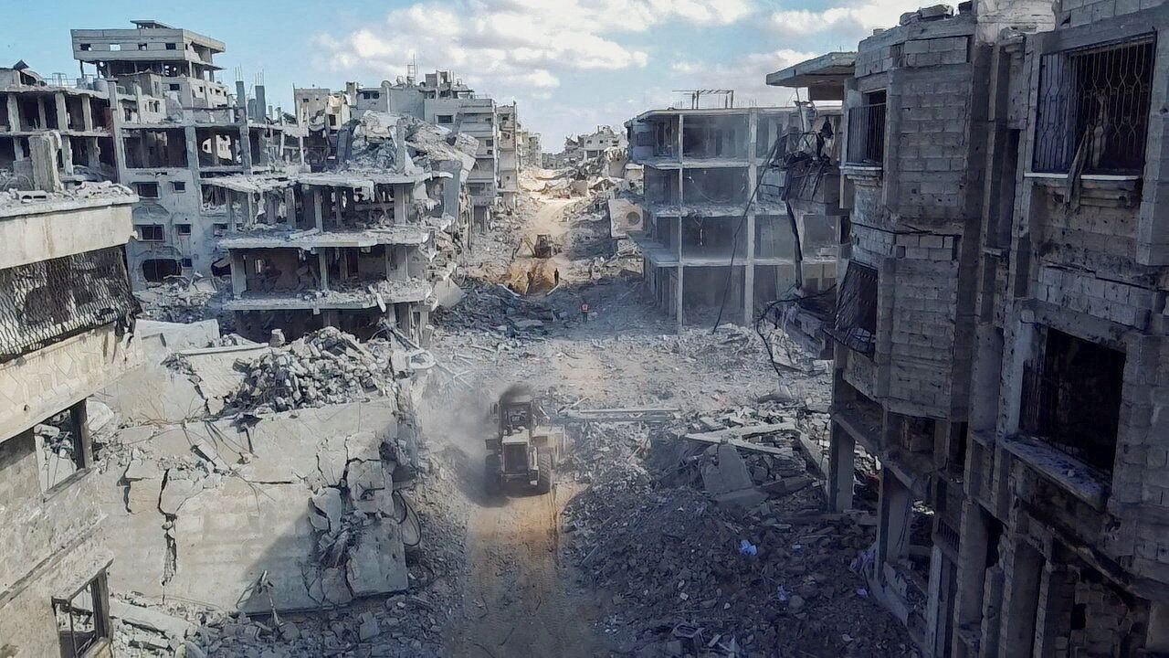 A drone view shows heavy machinery operating around a destroyed residential neighbourhood, following the withdrawal of the Israeli forces from the area, amid a ceasefire between Israel and Hamas in Gaza, in Gaza City, October 18, 2025. REUTERS/Dawoud Abu Alkas