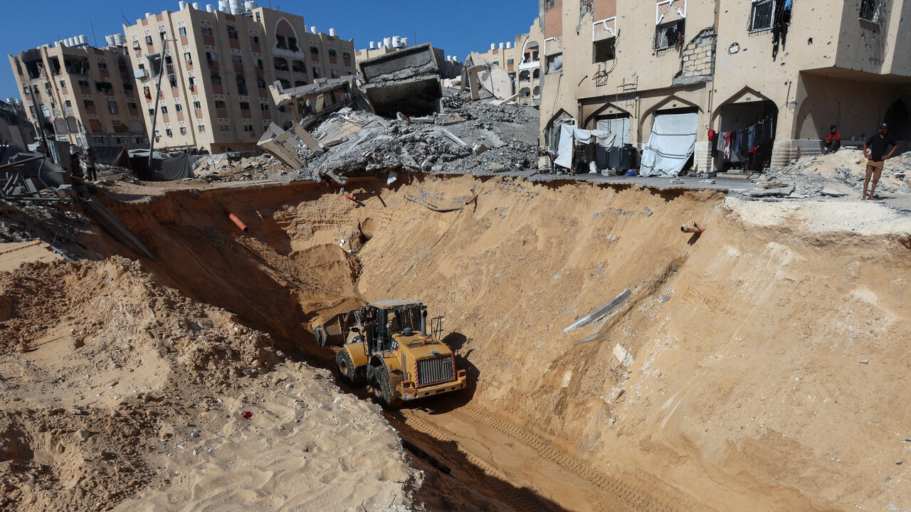 Heavy machinery operates at a site where searches for deceased hostages kidnapped by Hamas during the October 7, 2023, attack on Israel are underway amid a ceasefire between Israel and Hamas, in Khan Younis, southern Gaza Strip, October 19, 2025. REUTERS/Ramadan Abed