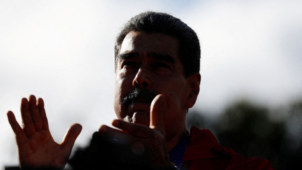 FILE PHOTO: Venezuela's President Nicolas Maduro participates in a demonstration to mark Indigenous Resistance Day, in Caracas, Venezuela, October 12, 2025. REUTERS/Leonardo Fernandez Viloria/File Photo