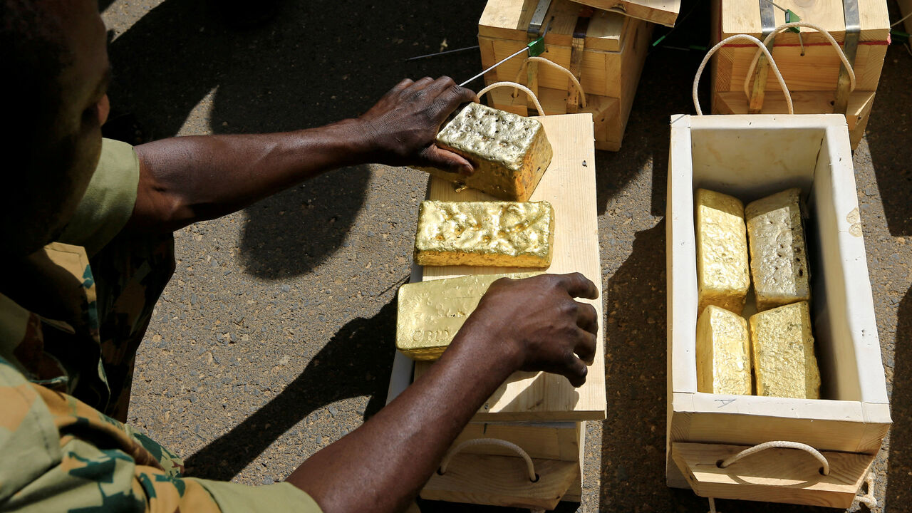 FILE PHOTO: Sudanese Rapid Support Forces (RSF) display gold bars seized from a plane that landed at Khartoum Airport in an investigation into possible smuggling, in Khartoum Sudan May 9, 2019. REUTERS/Mohamed Nureldin Abdallah/File Photo