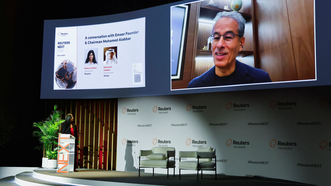 Emaar Founder and Chairman Mohamed Alabbar appears on-screen as he speaks with Reuters Gulf Bureau Chief Maha el Dahan at the Reuters NEXT Gulf Summit, in Abu Dhabi, United Arab Emirates, October 22, 2025. REUTERS/Rula Rouhana