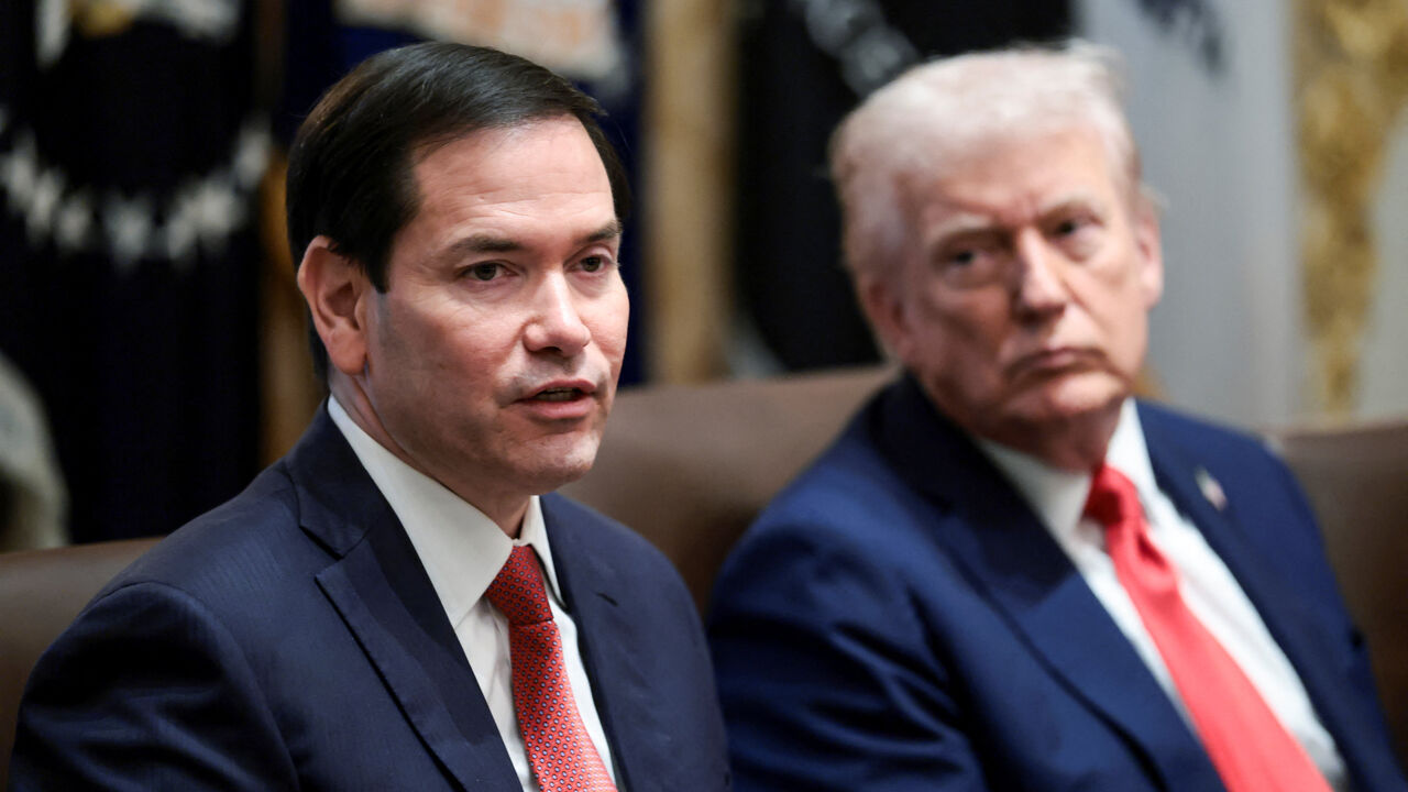 U.S. President Donald Trump listens as Secretary of State Marco Rubio speaks during a cabinet meeting at the White House, in Washington, D.C., U.S., October 9, 2025. REUTERS/Evelyn Hockstein
