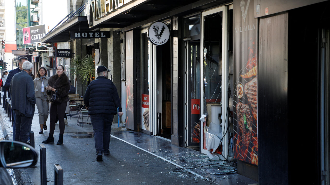 People walk past a demolished Turkish owned restaurant in downtown after, a man was stabbed and wounded in a late-night incident in Podgorica, Montenegro, October 27, 2025. REUTERS/Stevo Vasiljevic