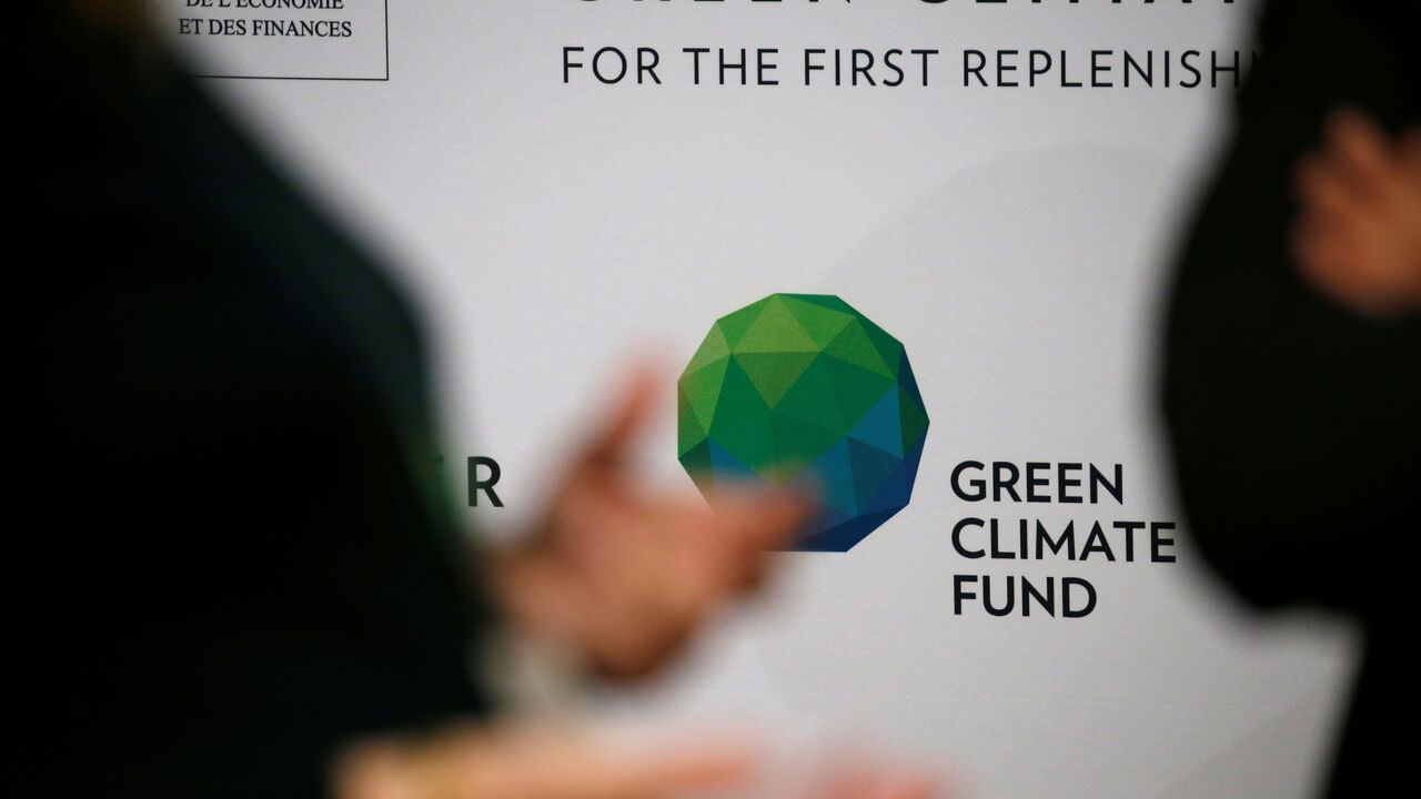 People arrive to attend the Pledging Conference of the Green Climate Fund (GCF) for the First Replenishment in Paris, France, October 25, 2019. REUTERS/Pascal Rossignol