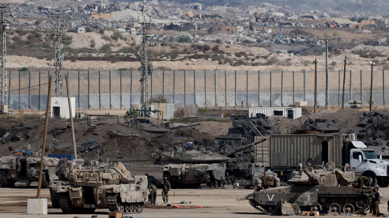 Israeli military personnel operate on the Israeli side of the Israel-Gaza border, on the day the Israeli military said it had resumed enforcing the Gaza ceasefire agreement after a series of strikes across the Gaza Strip, in southern Israel, October 29, 2025. REUTERS/Ammar Awad