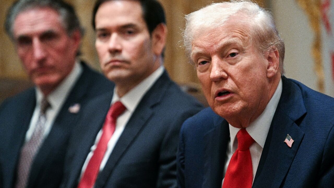 US President Donald Trump speaks alongside Secretary of the Interior Doug Burgum (L) and Secretary of State Marco Rubio (R) during a cabinet meeting in the Cabinet Room of the White House in Washington, DC, on October 9, 2025. Trump said Thursday he would try to go to Egypt for the signing of a Gaza ceasefire and hostage release deal between Israel and Hamas.
