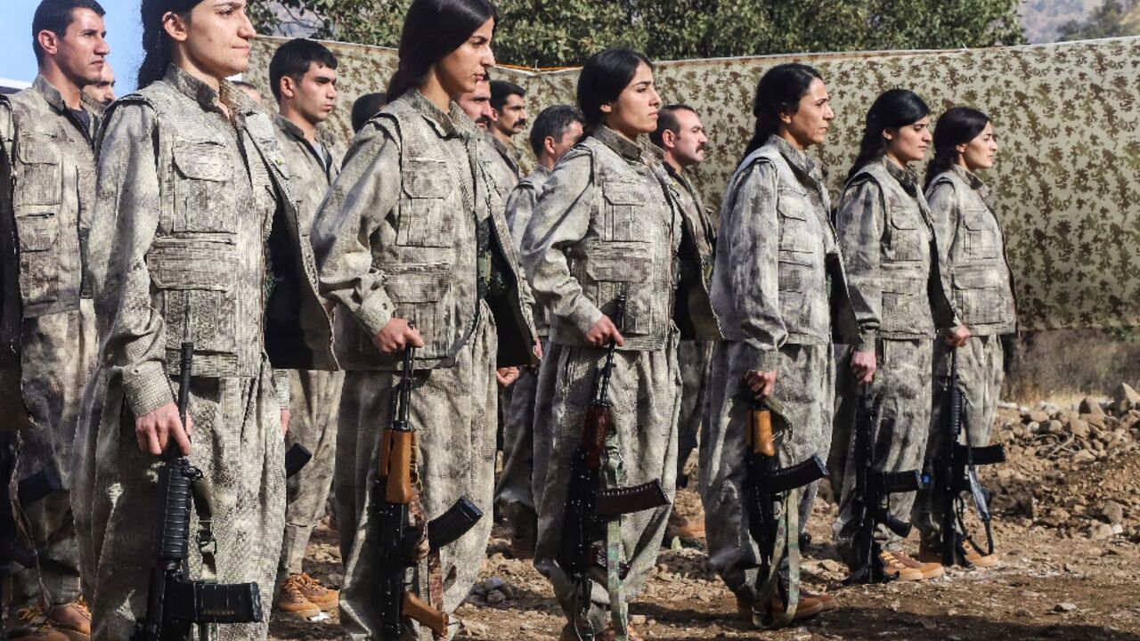 A first group of 25 PKK fighters who had left Turkey for northern Iraq were at the ceremony, among them eight women