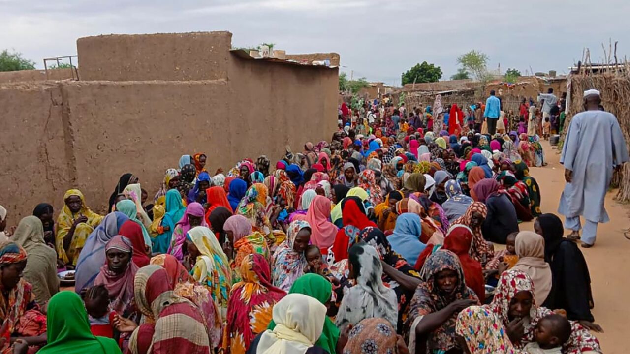 A file picture from August of people gathering to receive food in Sudan's El-Fasher, which has been under siege since 2023 