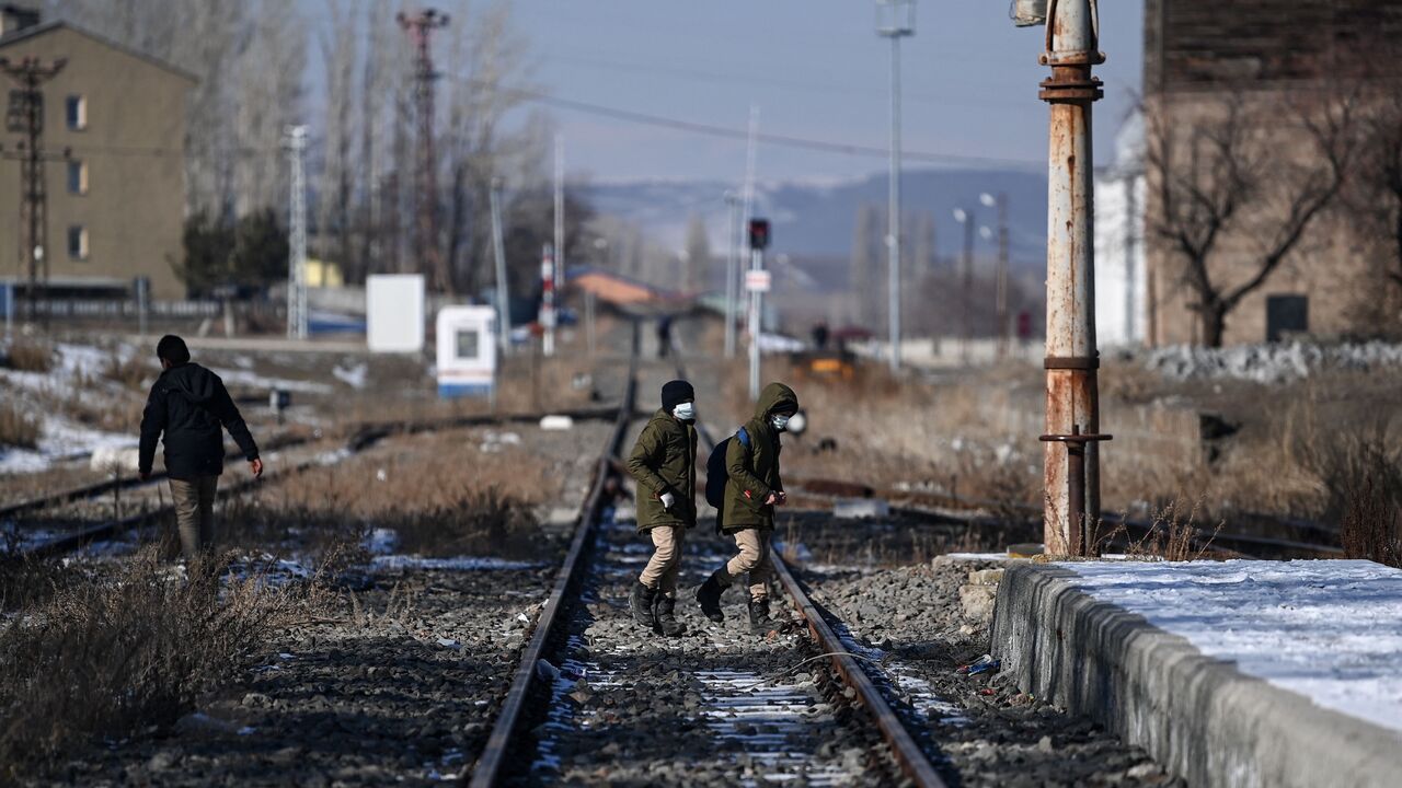 Several trucks carrying humanitarian aid cross the border between Armenia and Turkey at the village of Margara, Armenia, on March 21, 2025. 