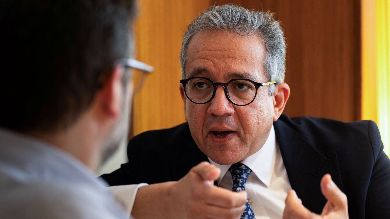 Khaled El-Enany, Egyptologist and former Minister of Tourism and Antiquities of Egypt, speaks during an interview with AFP at a hotel in Paris on April 10, 2025. 