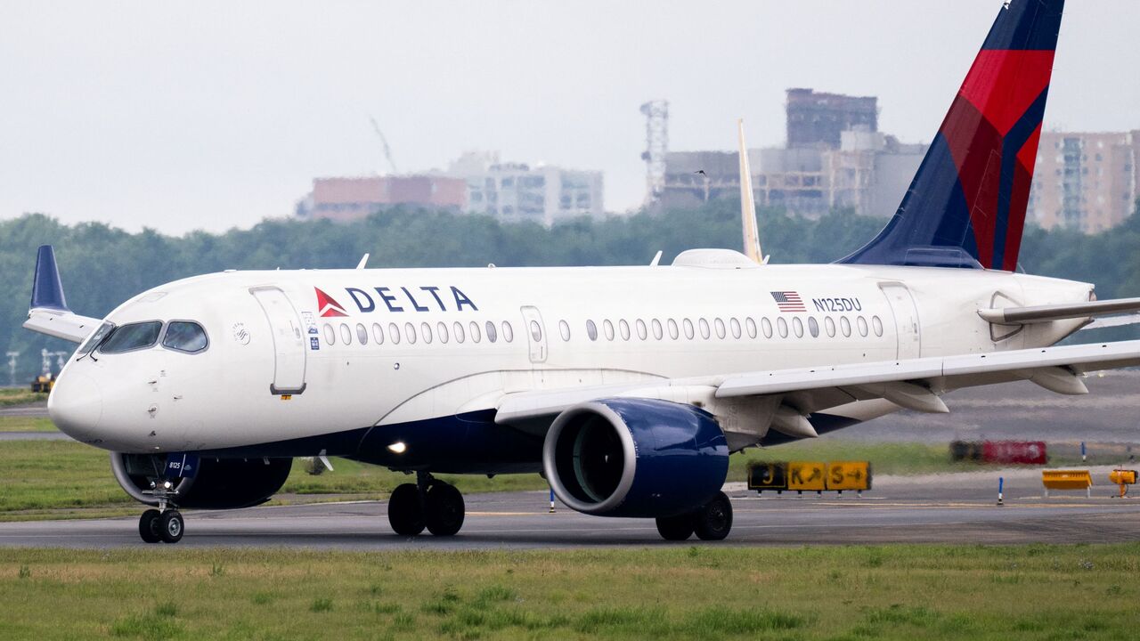 A Delta Air Lines Airbus A220 airplane prepares to takeoff at Ronald Reagan Washington National Airport in Arlington, Virginia, on July 10, 2025.