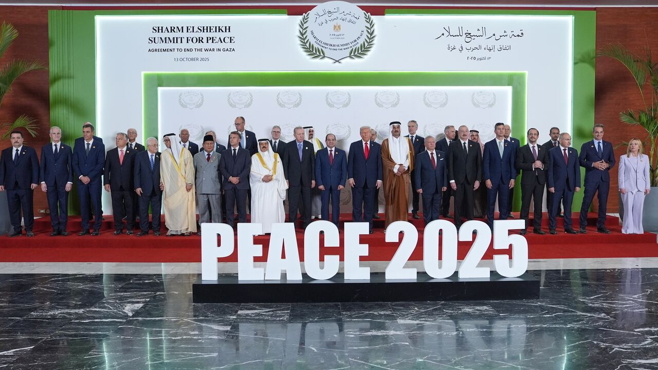 US President Donald Trump (C-R) and other world leaders pose for a photo during a summit of European and Middle Eastern leaders on Oct. 13, 2025, in Sharm el-Sheikh, Egypt. 