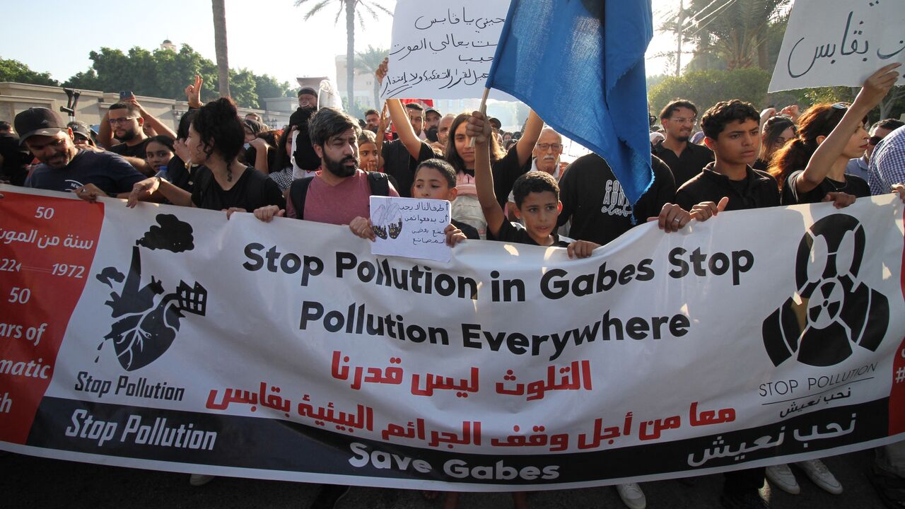 Residents of the city of Gabes carry placards during a demonstration on Oct. 15, 2025, to demand the closure of chemical factories.