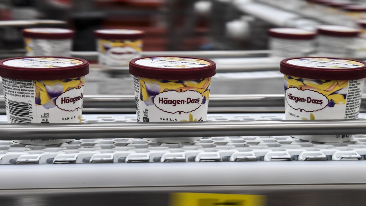 Cups of US ice cream brand Haagen-Dazs, are seen on a production line on Dec. 8, 2017, in a plant in Tilloy-les-Mofflaines, northern France. 