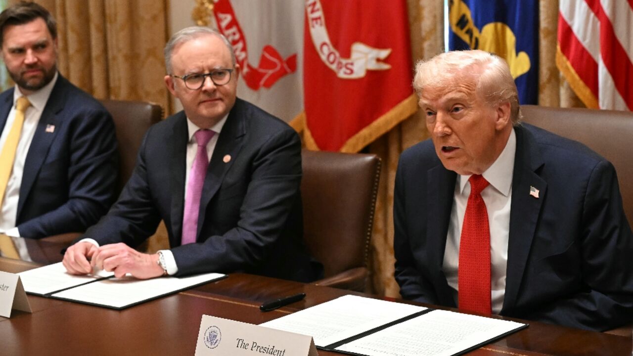 US President Donald Trump (R) speaks as he meets with Australia's Prime Minister Anthony Albanese (C) as Vice President JD Vance (L) looks on in the Cabinet Room at the White House in Washington, DC, on October 20, 2025. 