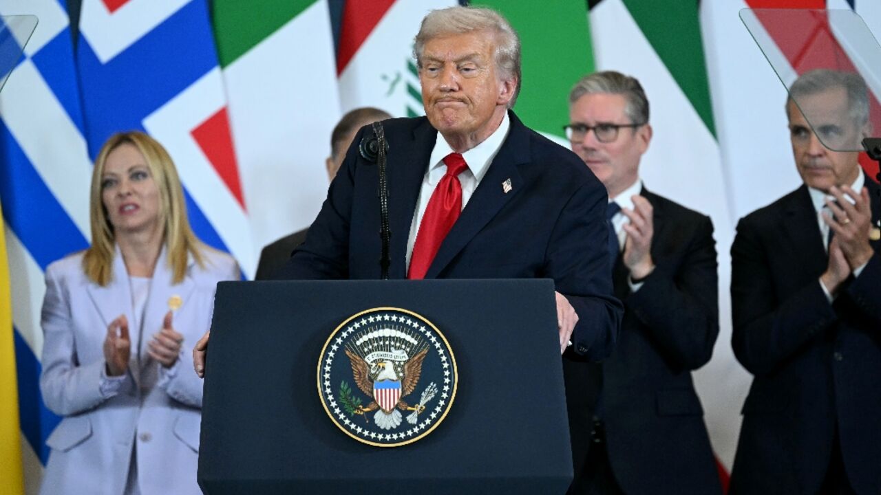 US President Donald Trump (C) speaks during a summit on Gaza in Sharm El-Sheikh, Egypt
