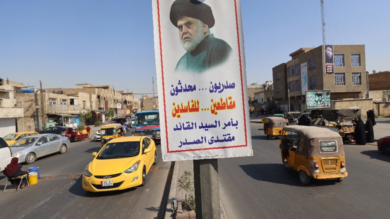 A poster flying in Baghdad's Sadr City district depicts influential Shiite cleric Moqtada Sadr and urges Iraqis to boycott parliamentary elections