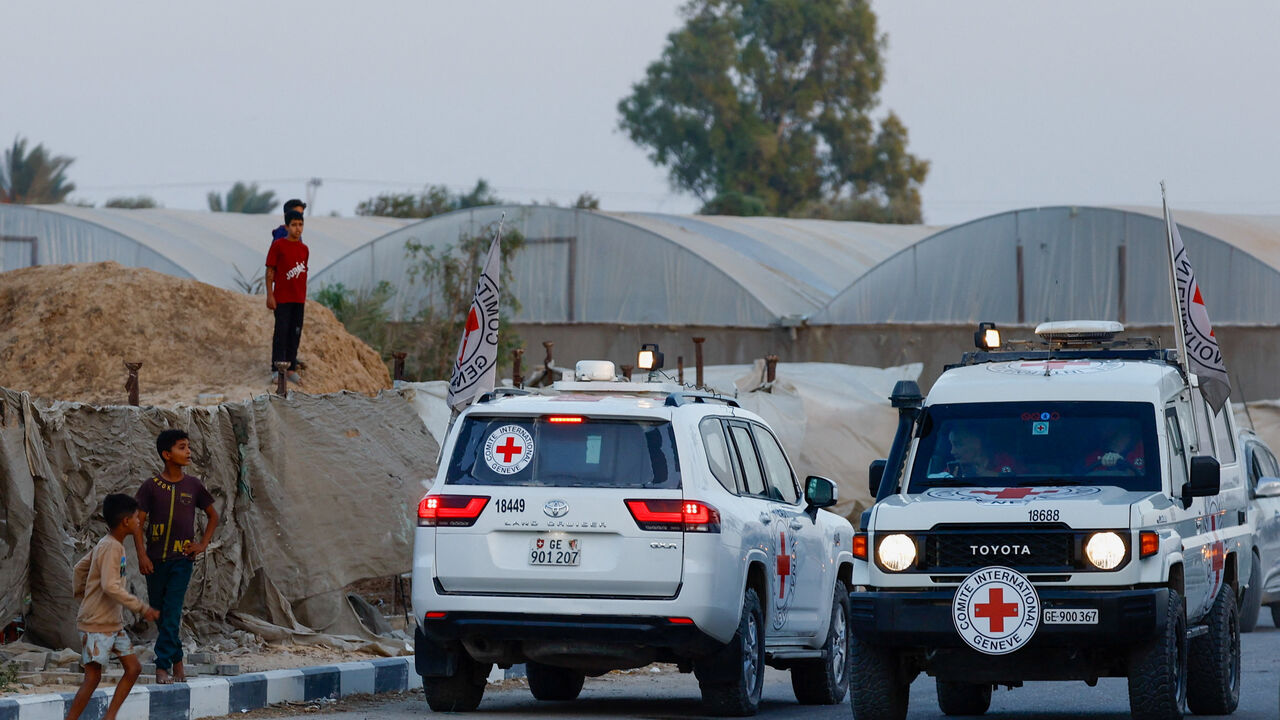 Red Cross transports the bodies of two deceased hostages, kidnapped during the October 7, 2023, attack on Israel by Hamas, after they were handed over by Hamas militants, in Deir Al-Balah, in the central Gaza Strip, October 30, 2025. REUTERS/Mahmoud Issa