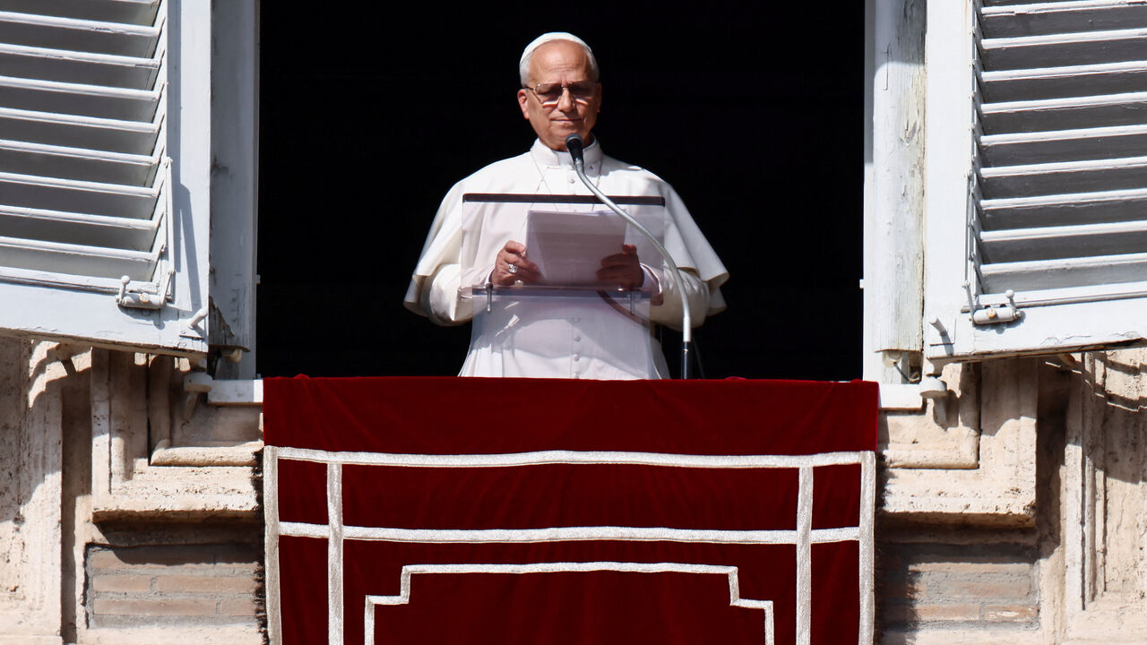 Pope Leo XIV leads the Angelus prayer from the window of the Apostolic Palace at the Vatican, November 2, 2025. REUTERS/Vincenzo Livieri