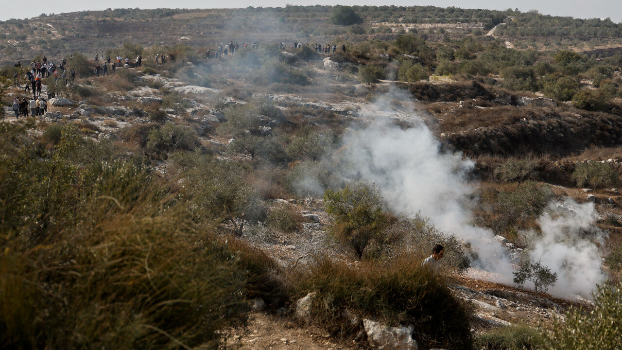 Smoke rises at the scene of a clash between Israeli soldiers and Palestinian protesters who went out to pray on their land, threatened by Israeli settlement expansion, in Beit Lid, near Tulkarm, in the Israeli-occupied West Bank, November 7, 2025. REUTERS/Raneen Sawafta