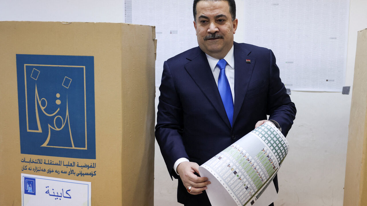 Iraqi Prime Minister Mohammed Shia al-Sudani votes at a polling station in the Green Zone during the parliamentary election, in Baghdad, Iraq, November 11, 2025. REUTERS/Ahmed Saad