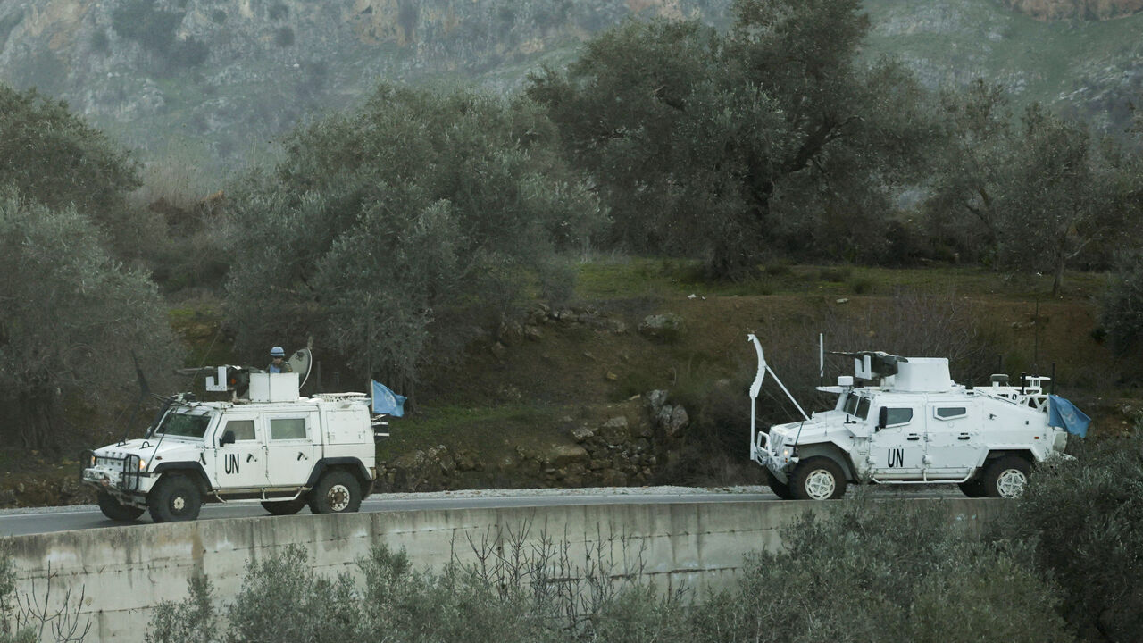 FILE PHOTO: UN peacekeepers (UNIFIL) vehicles ride along a street in Marjaayoun, Southern Lebanon January 20, 2025. REUTERS/Mohamed Azakir/File Photo