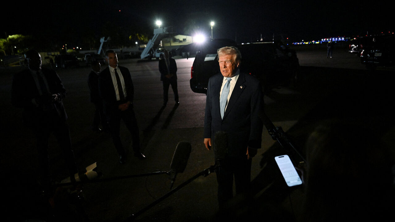 U.S. President Donald Trump speaks to members of the media at Joint Base Andrews, Maryland, U.S., November 16, 2025. REUTERS/Annabelle Gordon