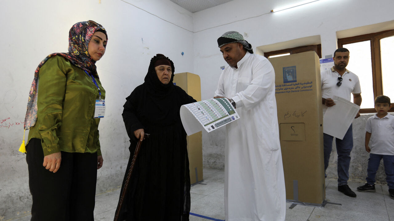 People vote at a polling station during the parliamentary election in Kirkuk, Iraq, November 11, 2025. REUTERS/Ako Rasheed