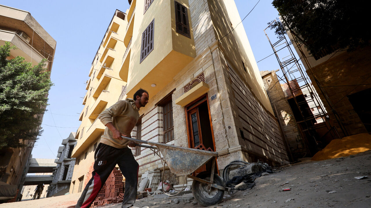 An Egyptian man works on-site at the Darb al-Labbana restoration project, designed to rebuild the historic yet dilapidated neighbourhood in old Cairo, Egypt, November 18, 2025. REUTERS/Mohamed Abd El Ghany