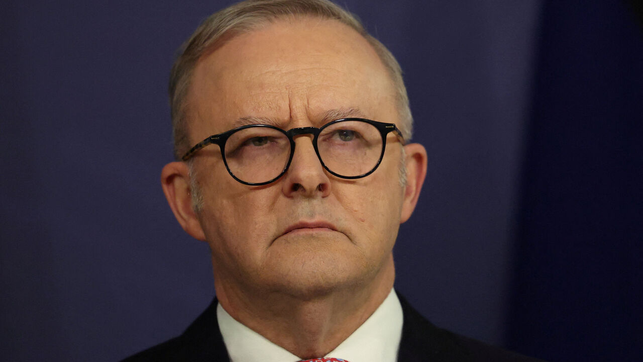 FILE PHOTO: Australian Prime Minister Anthony Albanese reacts during a press conference in Sydney, Australia, in Sydney, Australia,   September 12, 2025. REUTERS/Hollie Adams/File Photo