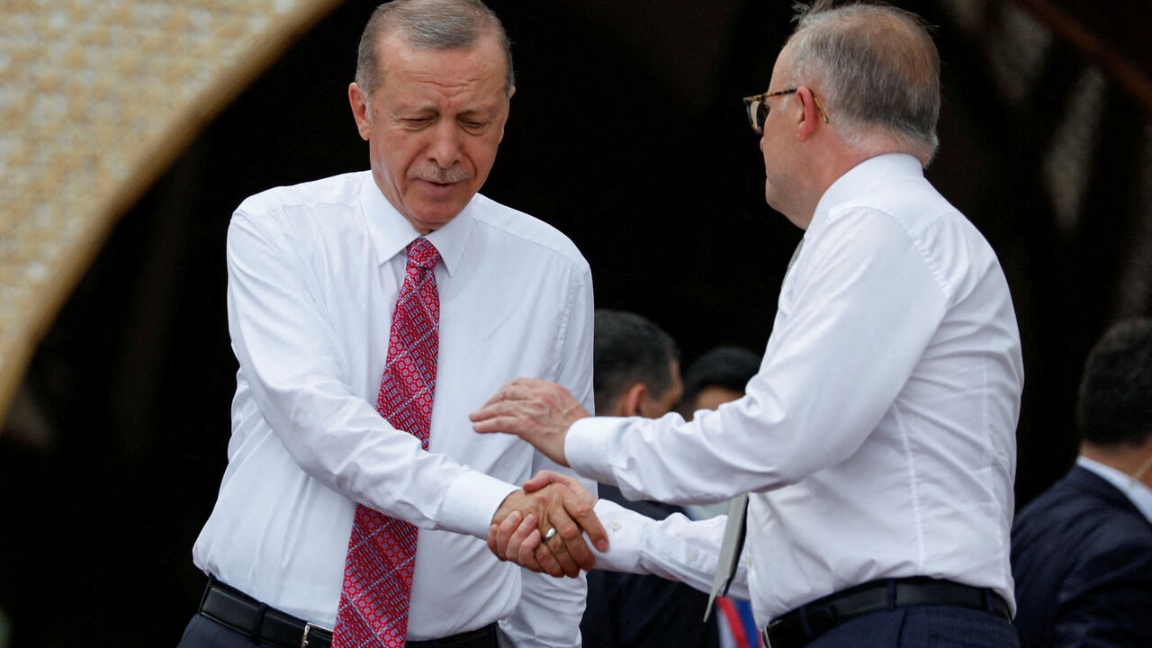 FILE PHOTO: Turkey's President Tayyip Erdogan shakes hands with Australia's Prime Minister Anthony Albanese before a MIKTA photo session amidst the G20 leaders' summit in Nusa Dua, Bali, Indonesia, November 15, 2022. REUTERS/Ajeng Dinar Ulfiana/Pool/File Photo
