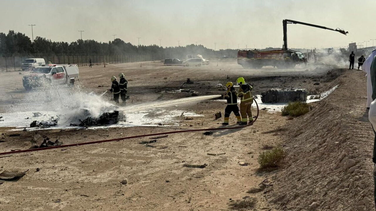 Firefighters work at the site of a crash involving an Indian-made HAL Tejas fighter jet at the Dubai Air Show, United Arab Emirates, November 21, 2025, in this handout picture obtained from social media.  Government of Dubai Media Office/Handout via REUTERS