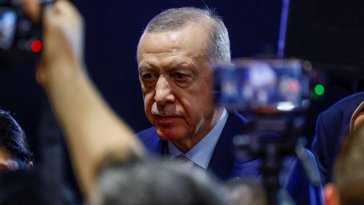 Turkey's President Tayyip Erdogan walks after speaking to the media, at the end of the G20 Leaders' Summit in Johannesburg, South Africa, November 23, 2025. REUTERS/Thomas Mukoya