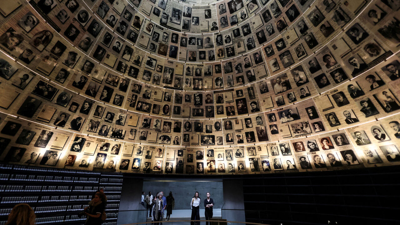 FILE PHOTO: Visitors tour an exhibition, ahead of Israel's national Holocaust memorial day at Yad Vashem, the World Holocaust Remembrance Center, in Jerusalem April 23, 2025. REUTERS/Ronen Zvulun/File Photo