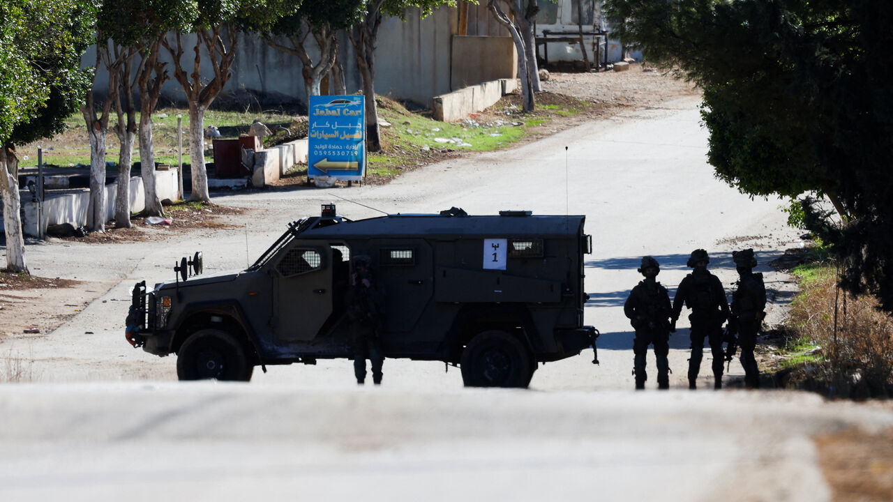 A military vehicle operates during an Israeli raid in Tammun near Tubas in the Israeli-occupied West Bank, November 26, 2025. REUTERS/Mohamad Torokman