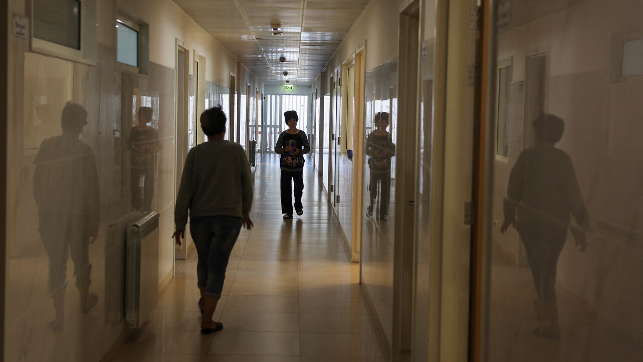 Patients walk along a hall at De La Croix Psychiatric Hospital in Jal el-Dib, Lebanon November 19, 2025. REUTERS/Mohamed Azakir