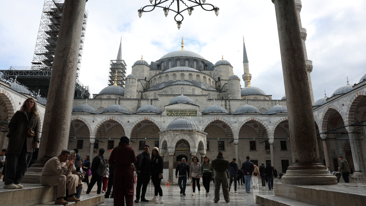 People visit the Ottoman-era Sultanahmet Mosque, known as the Blue Mosque, which Pope Leo XIV is expected to visit later this week, in Istanbul, Turkey, November 26, 2025. REUTERS/Dilara Senkaya