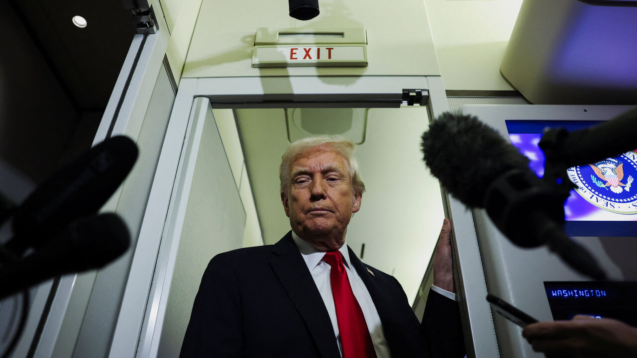 U.S. President Donald Trump looks on as he speaks to reporters aboard Air Force One during travel to Palm Beach, Florida, from Joint Base Andrews, Maryland, U.S., November 25, 2025. REUTERS/Anna Rose Layden