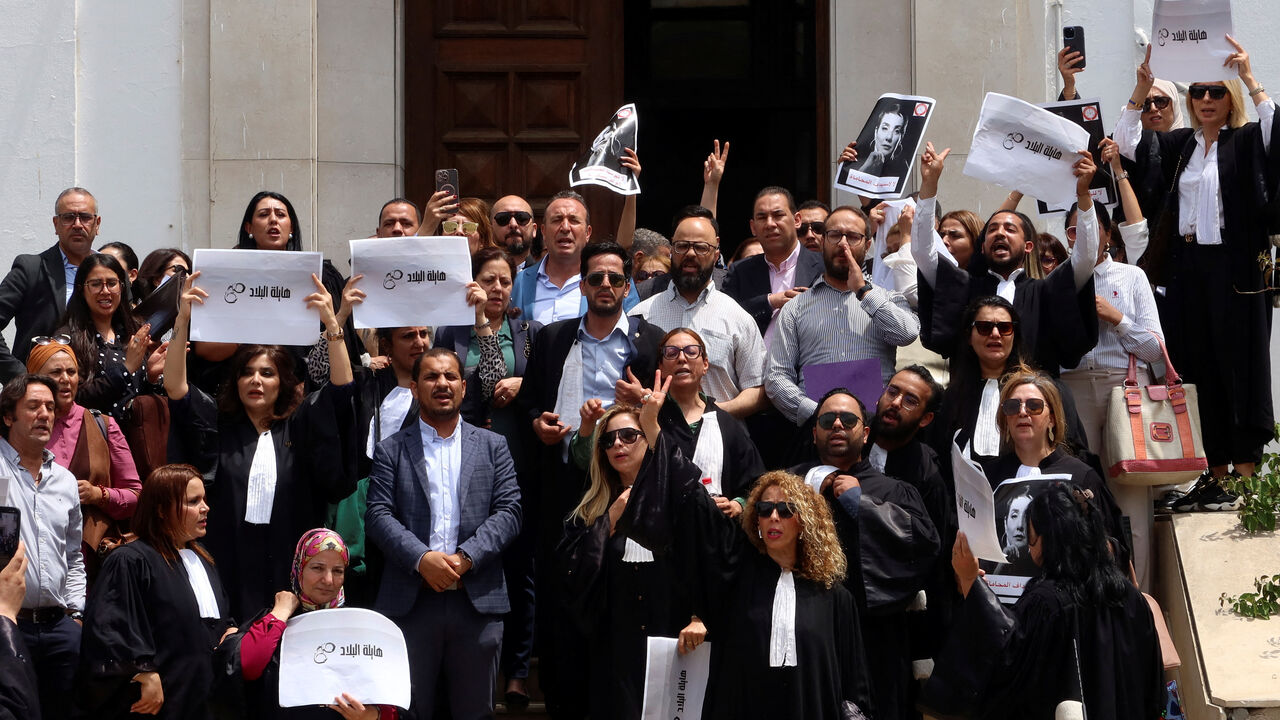 Lawyers carry banners during a protest against the arrest of Sonia Dahmani, a prominent lawyer critical of the president, outside the Palace of Justice building in Tunis, Tunisia May 13, 2024. REUTERS/Jihed Abidellaoui