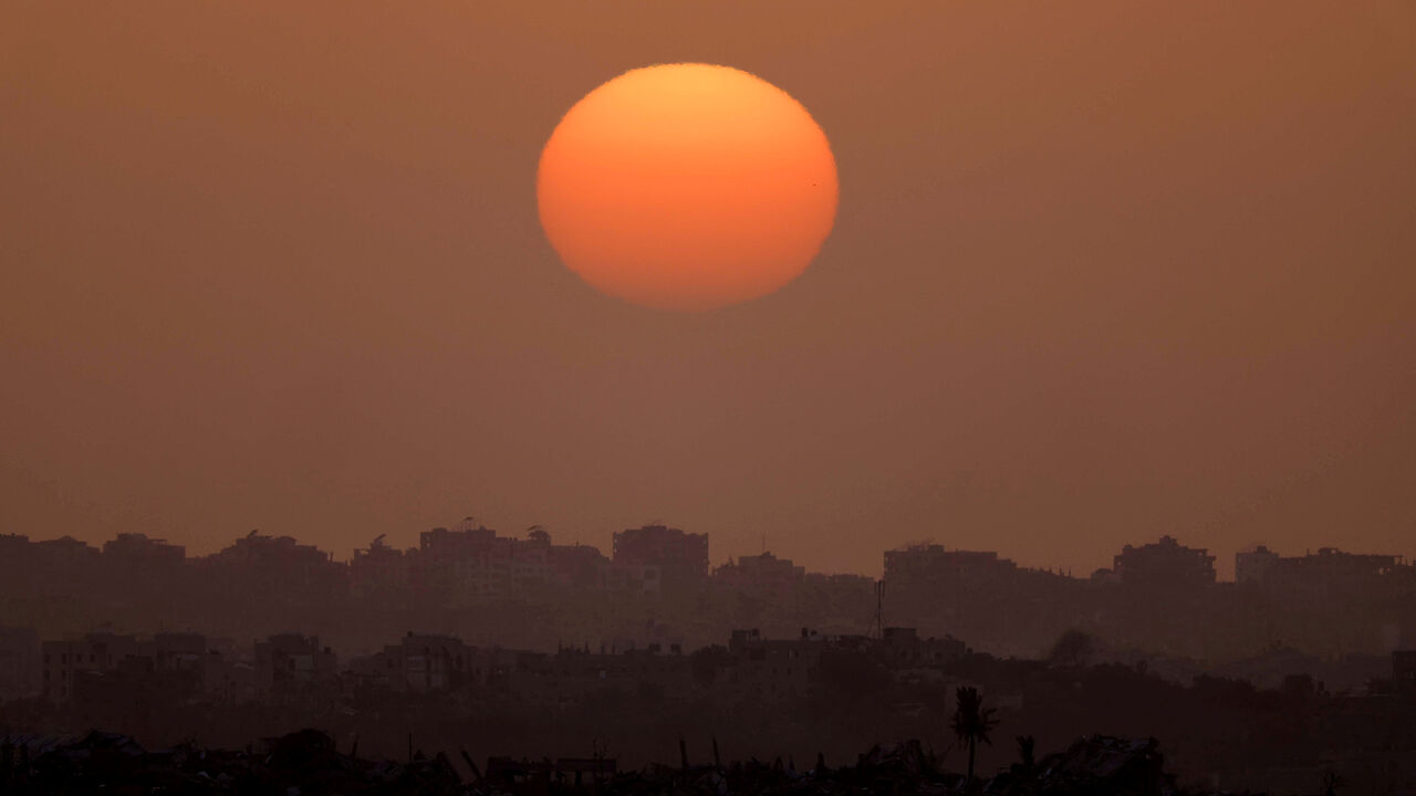 The sun sets over Gaza, amid the ongoing conflict between Israel and the Palestinian Islamist group Hamas, as seen from the border with Gaza in southern Israel, April 1, 2024. REUTERS/Hannah McKay
