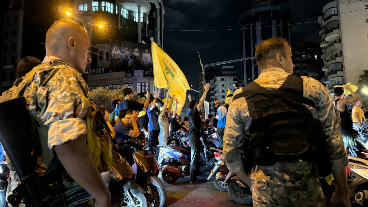 (FILES) Lebanese soldiers deploy as supporters of the militant group Hezbollah take to the streets to protest the government's endorsement of a plan to disarm the group, in Beirut's southern suburb