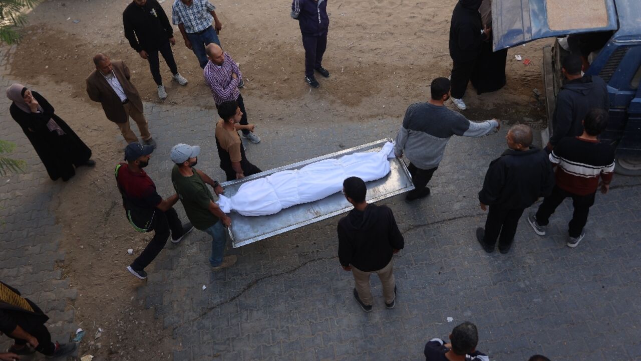 Mourners at Al-Shifa Hospital in Gaza City carry the body of a Palestinian who, according to medics, was killed in an Israeli military strike