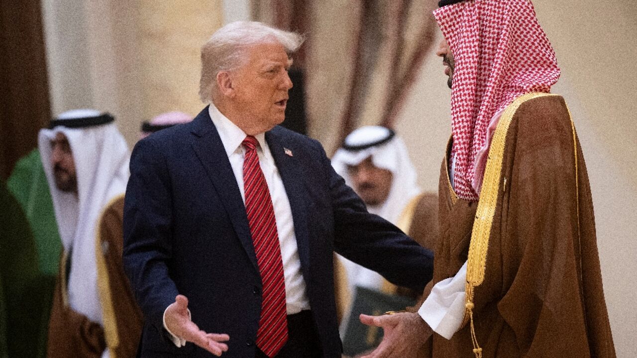 Trump (L) met Saudi Crown Prince Mohammed bin Salman in Riyadh in May