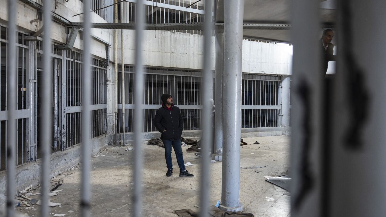 A Syrian man inspects the prison of Saydnaya, north of Damascus on Dec. 16, 2024.
